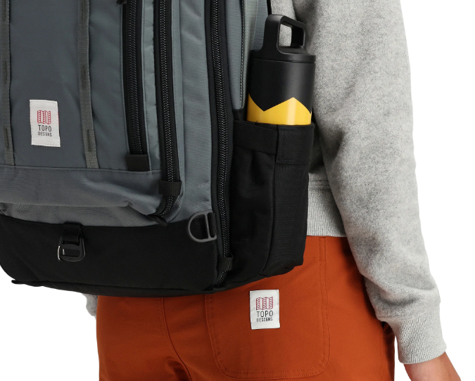 a bottle in a laptop backpack